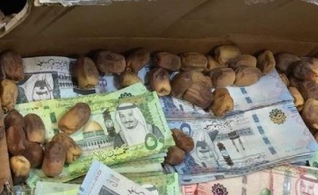 بالصور.. إحباط تهريب 1.65 مليون ريال داخل كراتين تمر وملابس في مطار المدينة